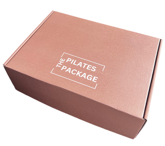 Brown box with The Pilates Package in white on top 